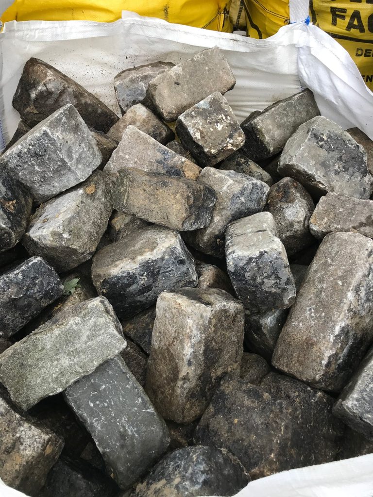 Reclaimed building stone granite setts silver grey colour hand picked into bulk bags